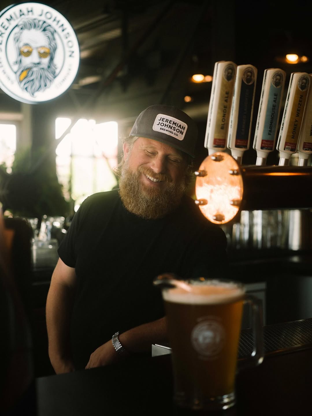 Jeremiah Johnson wearing his hat in the brewery 